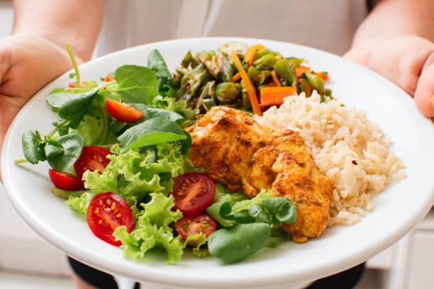 A beautifully plated balanced meal with colorful vegetables and proteins